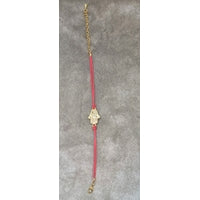 Bracelet fil rouge avec main dorée en rodium